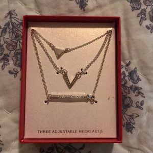 Three adjustable necklaces.